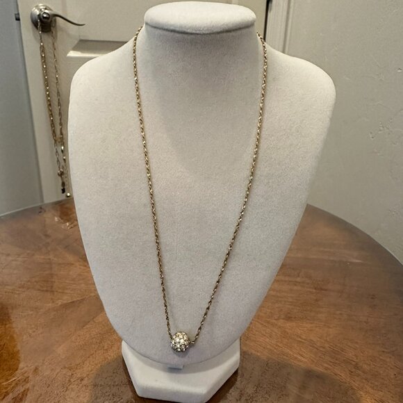 This necklace is a gold-tone with a rhinestone ball pendant. - Picture 1 of 7